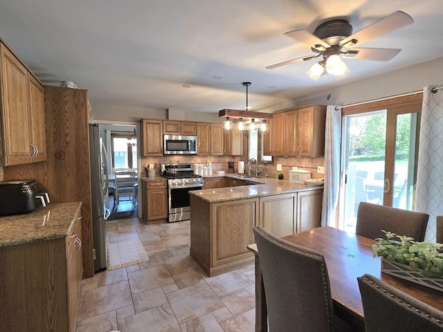 574 Aberdeen Rd, Frankfort, IL 60423 - kitchen featuring stainless steel appliances, a sink, plenty of natural light, and decorative backsplash