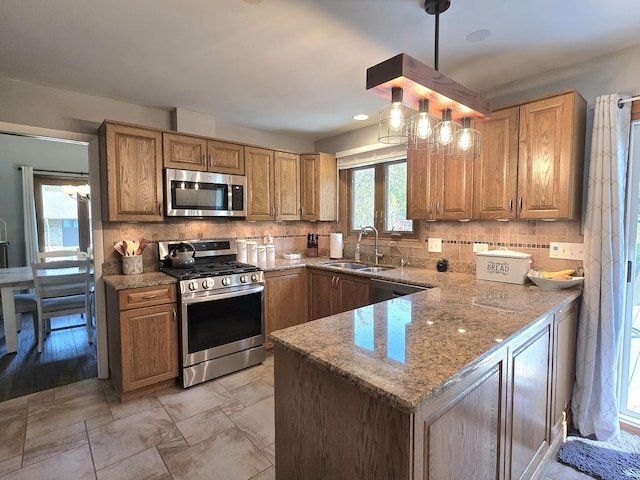 574 Aberdeen Rd, Frankfort, IL 60423 - kitchen featuring appliances with stainless steel finishes, a sink, tasteful backsplash, and light stone counters