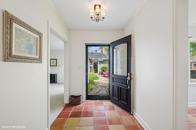 836 E Glenwood Rd, Glenview, IL 60025 - entryway with a chandelier, crown molding, tile patterned floors, and baseboards