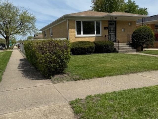 772 Memorial Dr, Calumet City, IL 60409 - view of front of house with brick siding and a front lawn