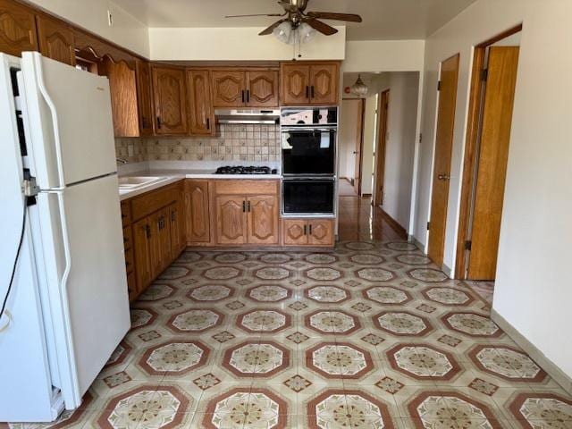 772 Memorial Dr, Calumet City, IL 60409 - kitchen featuring freestanding refrigerator, ceiling fan, light countertops, tasteful backsplash, and under cabinet range hood