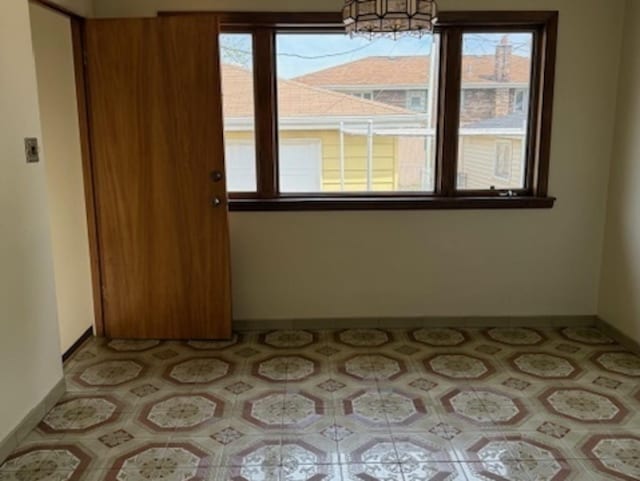 772 Memorial Dr, Calumet City, IL 60409 - spare room featuring baseboards
