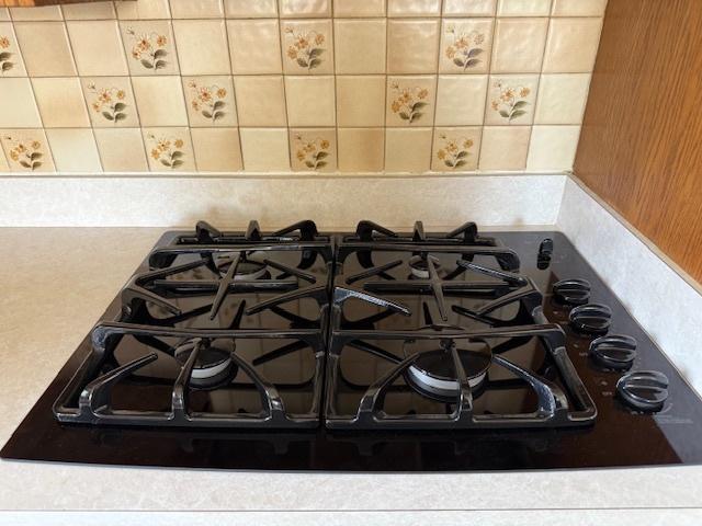 772 Memorial Dr, Calumet City, IL 60409 - kitchen view of black gas cooktop and tasteful backsplash