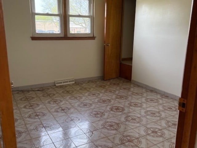 772 Memorial Dr, Calumet City, IL 60409 - spare room featuring baseboards and light flooring