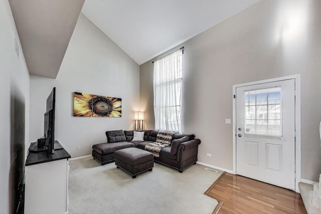 1479 N Denton Ave, Palatine, IL 60067 - living room with high vaulted ceiling, plenty of natural light, baseboards, and wood finished floors