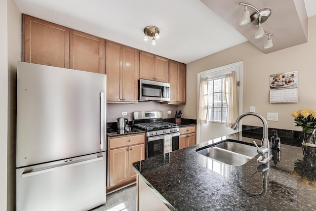 1479 N Denton Ave, Palatine, IL 60067 - kitchen featuring appliances with stainless steel finishes, a sink, dark stone counters, brown cabinets, and a peninsula