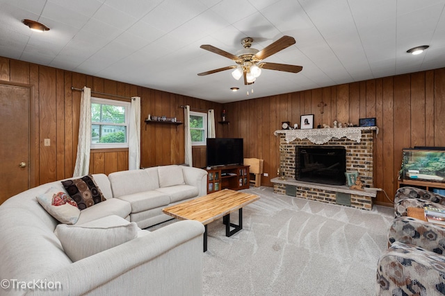 4929 Washington St, Downers Grove, IL 60515 - living room featuring ceiling fan, carpet, wooden walls, and a brick fireplace