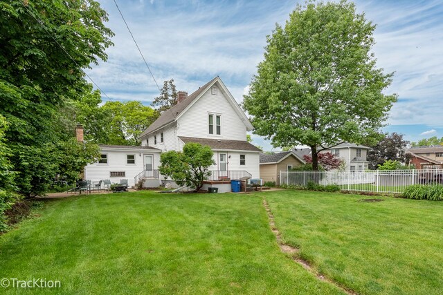 4929 Washington St, Downers Grove, IL 60515 - rear view of property featuring a chimney and a shingled roof