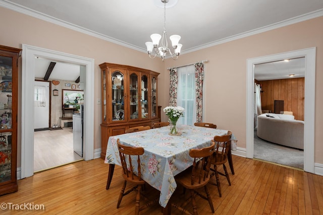 4929 Washington St, Downers Grove, IL 60515 - dining room featuring light wood-style floors, a chandelier, and crown molding