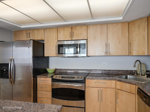 155 N Harbor Dr Unit 2011, Chicago, IL 60601 - kitchen featuring stainless steel appliances, dark stone countertops, and light brown cabinets