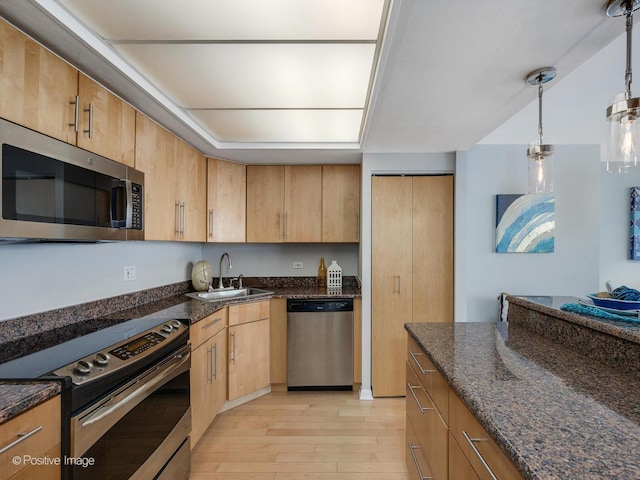 155 N Harbor Dr Unit 2011, Chicago, IL 60601 - kitchen with appliances with stainless steel finishes, light wood-style flooring, dark stone countertops, and decorative light fixtures