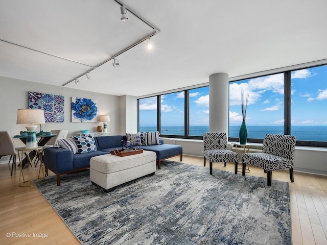 155 N Harbor Dr Unit 2011, Chicago, IL 60601 - living area with rail lighting, a water view, and light wood-style floors