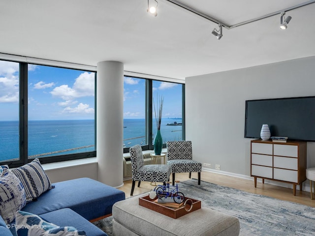 155 N Harbor Dr Unit 2011, Chicago, IL 60601 - living room featuring track lighting, a water view, wood finished floors, and floor to ceiling windows