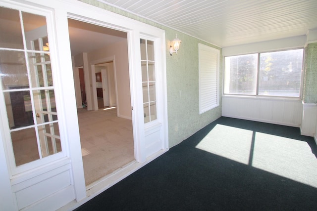 unfurnished sunroom with french doors and a chandelier