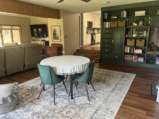 2493 W Mud Creek Rd, Mount Morris, IL 61054 - dining room with dark wood-style flooring, ceiling fan, and a textured ceiling