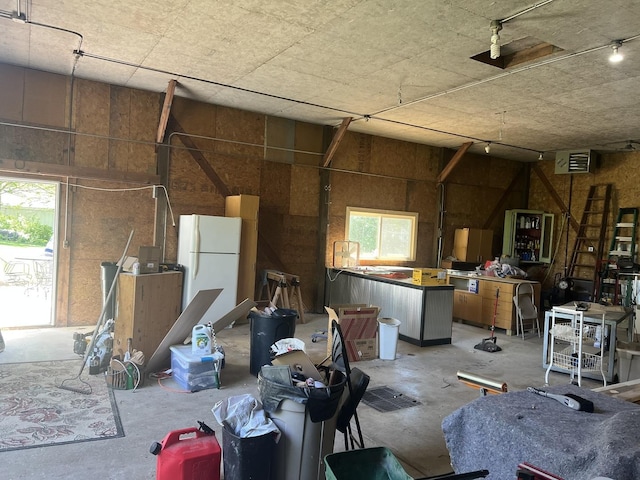 2493 W Mud Creek Rd, Mount Morris, IL 61054 - miscellaneous room featuring unfinished concrete floors and a garage