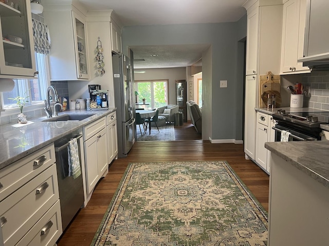 2493 W Mud Creek Rd, Mount Morris, IL 61054 - kitchen with stainless steel appliances, a sink, white cabinetry, and dark wood-type flooring