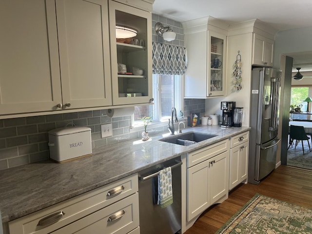 2493 W Mud Creek Rd, Mount Morris, IL 61054 - kitchen with stainless steel appliances, a sink, dark wood-type flooring, white cabinetry, and light stone countertops