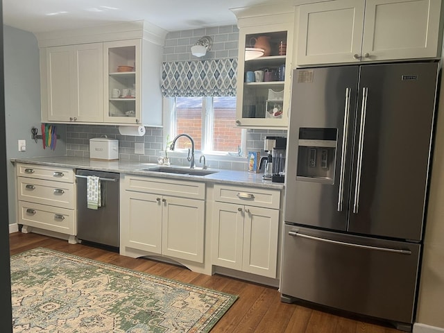 2493 W Mud Creek Rd, Mount Morris, IL 61054 - kitchen featuring stainless steel appliances, a sink, tasteful backsplash, and glass insert cabinets