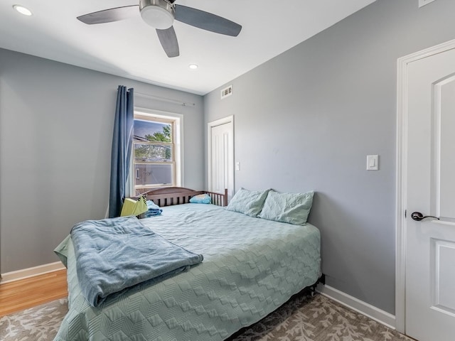5717 N Kimball Ave Unit 2N, Chicago, IL 60659 - bedroom with baseboards, recessed lighting, ceiling fan, wood finished floors, and a closet