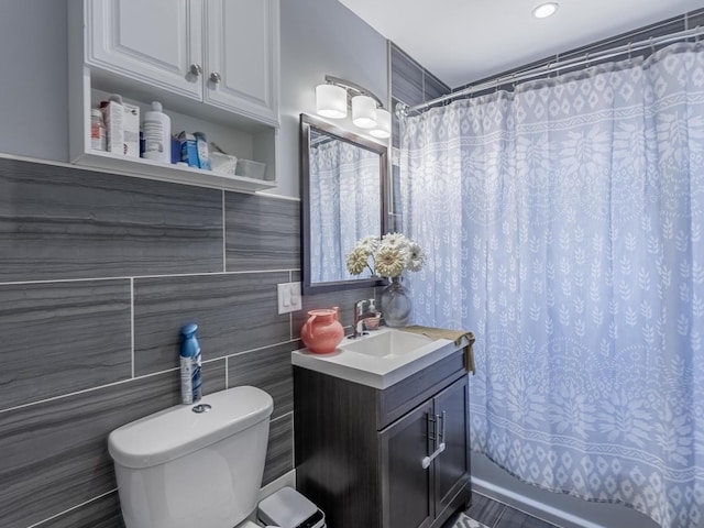 5717 N Kimball Ave Unit 2N, Chicago, IL 60659 - bathroom featuring vanity, toilet, tile walls, and a shower with curtain