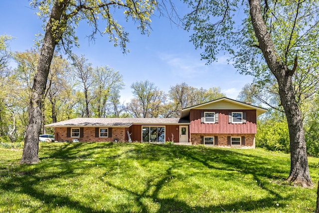 4182 Dawson Lake Rd, Poplar Grove, IL 61065 - split level home with board and batten siding, brick siding, and a front yard