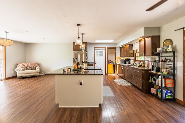4182 Dawson Lake Rd, Poplar Grove, IL 61065 - kitchen with dark wood finished floors, a center island, stainless steel appliances, a sink, and pendant lighting
