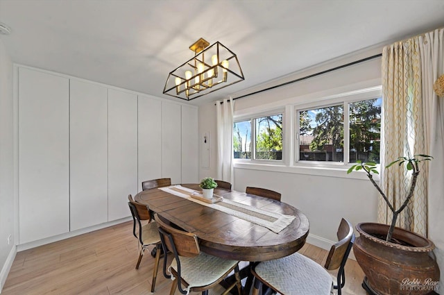 1224 S Mount Prospect Rd, Des Plaines, IL 60018 - dining space featuring light wood-style flooring, healthy amount of natural light, and a chandelier