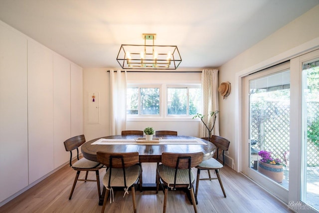 1224 S Mount Prospect Rd, Des Plaines, IL 60018 - dining area featuring plenty of natural light, light wood-style flooring, and a chandelier