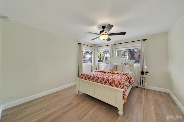 1224 S Mount Prospect Rd, Des Plaines, IL 60018 - bedroom featuring baseboards, light wood-style flooring, and a ceiling fan