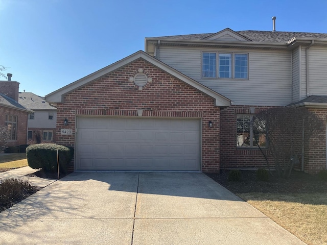 9423 Caledonia Dr, Tinley Park, IL 60487 - traditional-style home with driveway, brick siding, and a garage