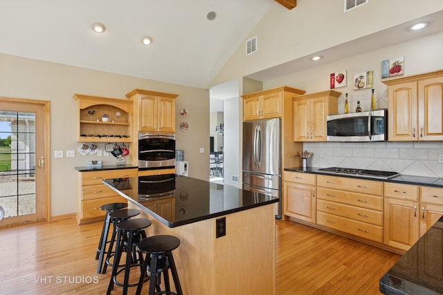 23803 E 3100 N Rd, Dwight, IL 60420 - kitchen featuring stainless steel appliances, light brown cabinetry, a breakfast bar, open shelves, and high vaulted ceiling
