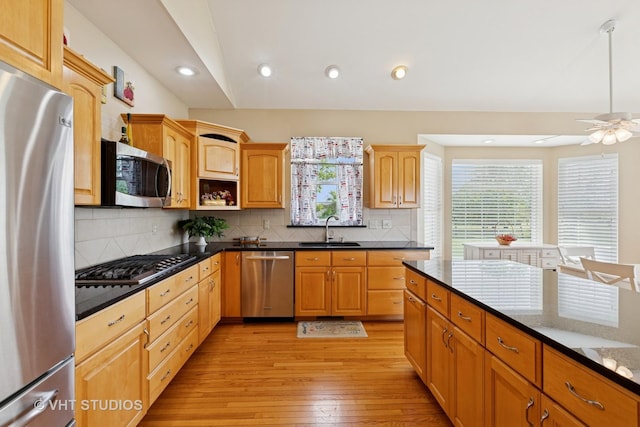 23803 E 3100 N Rd, Dwight, IL 60420 - kitchen featuring appliances with stainless steel finishes, a sink, light wood-style flooring, decorative backsplash, and recessed lighting