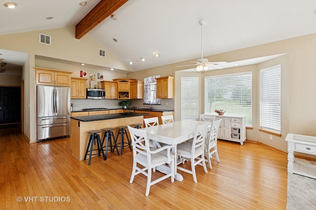 23803 E 3100 N Rd, Dwight, IL 60420 - dining space featuring beam ceiling, light wood-type flooring, a ceiling fan, and high vaulted ceiling