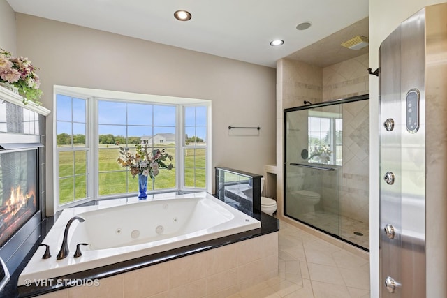 23803 E 3100 N Rd, Dwight, IL 60420 - bathroom with toilet, a whirlpool tub, plenty of natural light, a shower stall, and recessed lighting