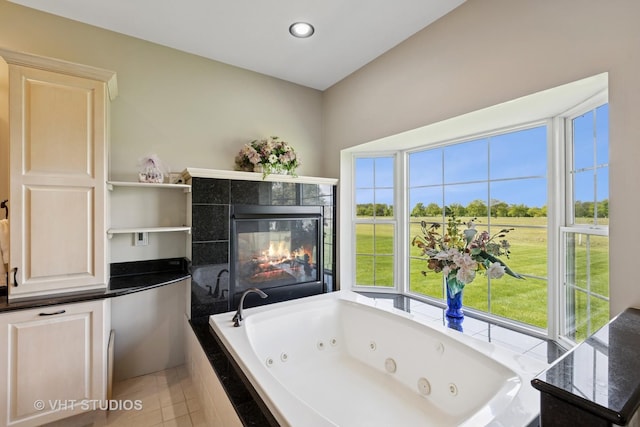 23803 E 3100 N Rd, Dwight, IL 60420 - full bathroom with a jetted tub, a tile fireplace, tile patterned flooring, and recessed lighting