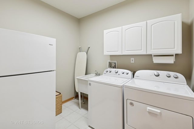 23803 E 3100 N Rd, Dwight, IL 60420 - washroom with cabinet space, washer and clothes dryer, light tile patterned floors, and baseboards