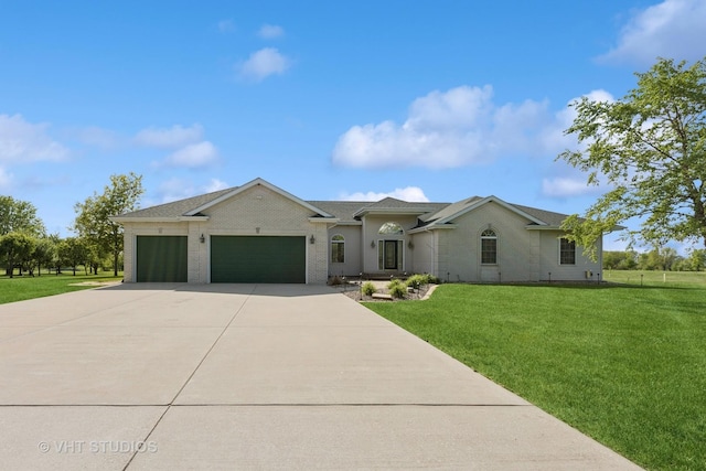 23803 E 3100 N Rd, Dwight, IL 60420 - view of front of house featuring a garage, driveway, a front lawn, and brick siding