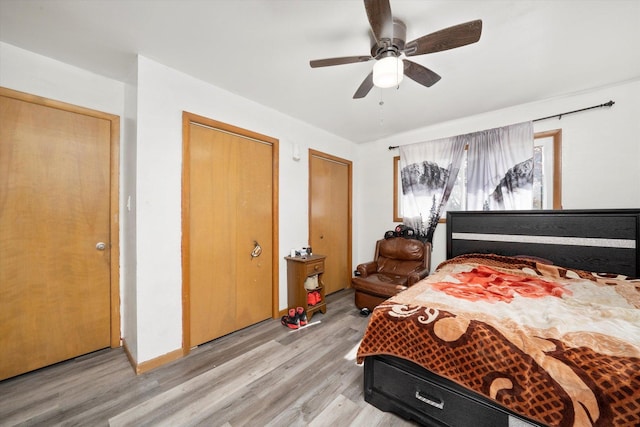296 E Crest Ave, Bensenville, IL 60106 - bedroom featuring light wood finished floors, ceiling fan, and multiple closets