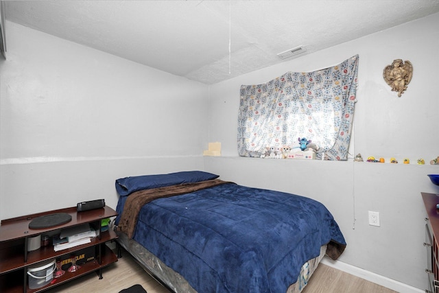 296 E Crest Ave, Bensenville, IL 60106 - bedroom featuring wood finished floors and baseboards