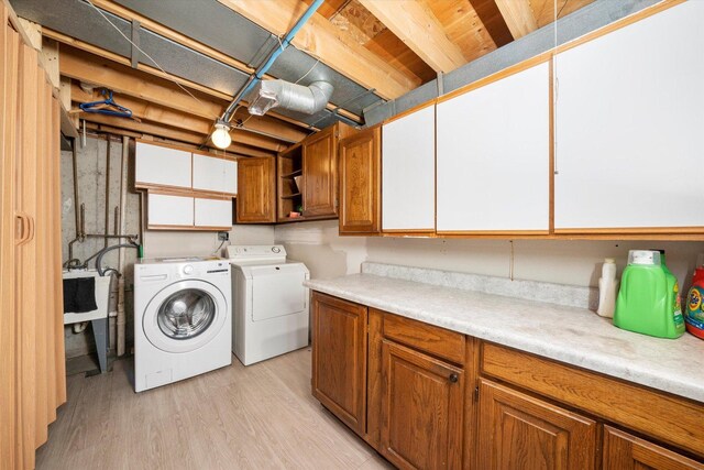 296 E Crest Ave, Bensenville, IL 60106 - clothes washing area featuring cabinet space, separate washer and dryer, and light wood finished floors