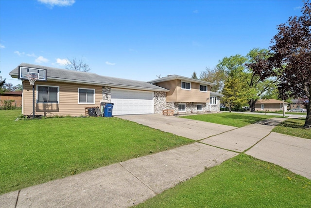 296 E Crest Ave, Bensenville, IL 60106 - tri-level home with stone siding, a garage, driveway, and a front yard