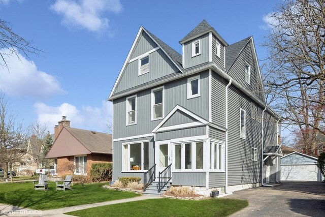 208 Fairbank Rd, Riverside, IL 60546 - view of front facade with entry steps, an outbuilding, a front yard, and a shingled roof