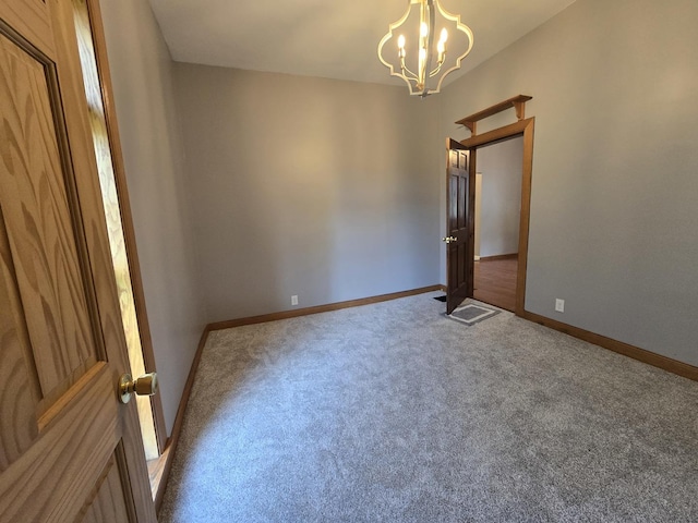 310 N Mulberry St, Clinton, IL 61727 - carpeted spare room featuring a chandelier and baseboards