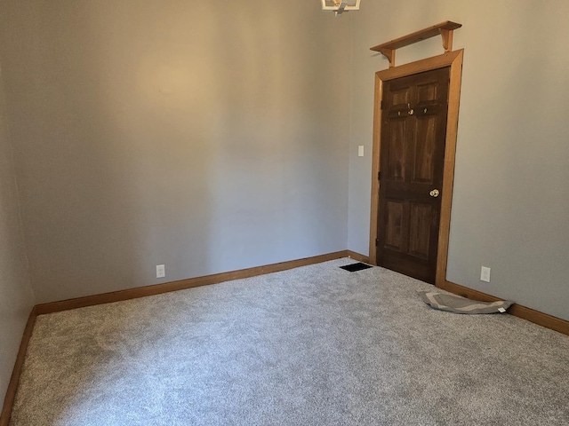 310 N Mulberry St, Clinton, IL 61727 - entrance foyer featuring carpet flooring and baseboards