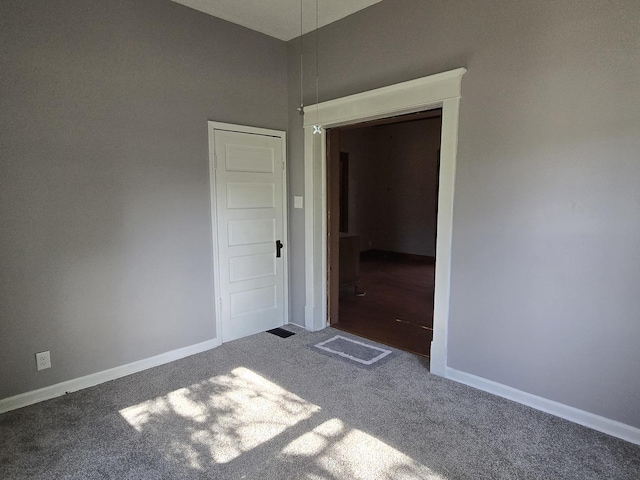 310 N Mulberry St, Clinton, IL 61727 - carpeted spare room with baseboards
