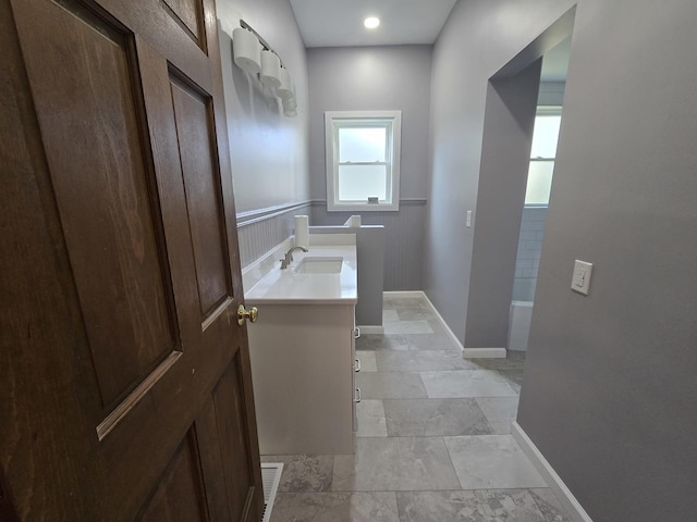 310 N Mulberry St, Clinton, IL 61727 - bathroom featuring vanity and baseboards