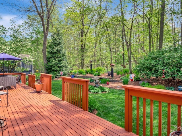 deck featuring a lawn and outdoor dining space