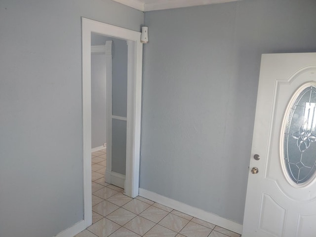 entryway featuring light tile patterned flooring and baseboards