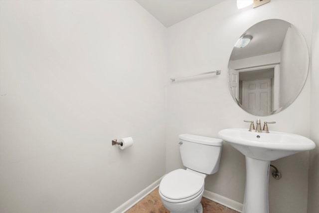2747 Perry Rd, Flossmoor, IL 60422 - bathroom with baseboards, toilet, and a sink